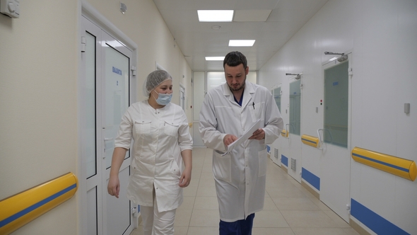 The Doctor Gives the Nurse a Job in the Hospital Corridor on His Way To the Ward