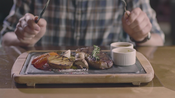 Only Hands: Man in Grill Restaurant Waiting Steak