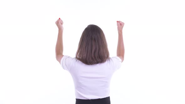 Rear View of Happy Businesswoman with Fists Raised