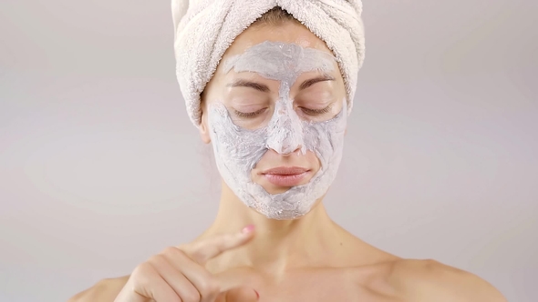 Portrait of a Beautiful Young Girl with a Pore Cleansing Mask Pig Face. She's Dancing Hands and