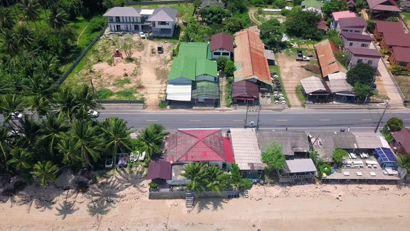 Aerial View of Transport Moving on Street Along Beach at Tropical Island in Thailand