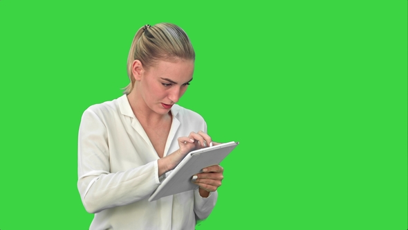 Businesswoman Standing with Digital Tablet on Green Screen