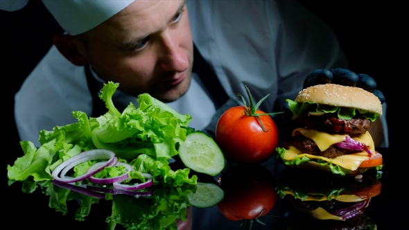 Chef Finishing the Savory Burger with Beef, Cheese and Vegetables