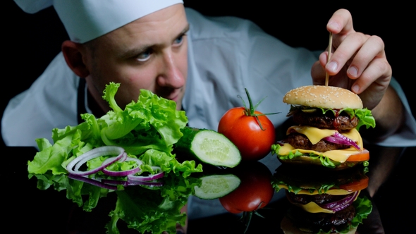 Chef Finishing the Savory Burger with Beef, Cheese and Vegetables