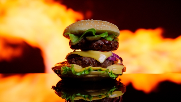 Delicious Burger Is on Fire on the Black Mirror Surface