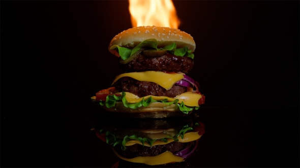 Hot Burger on the Black Mirror Surface on Fire Black Background for Commercial