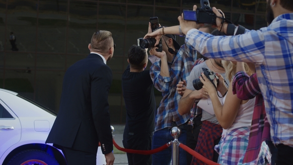 Sportsman Fighter Posing for Photographers on Red Carpet