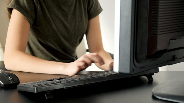 Young Girl Hands Typing on the Computer Keyboard