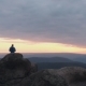 Drone Shot of Lonely Man Standing on Top of a Mountain and Enjoying the Sunset - VideoHive Item for Sale