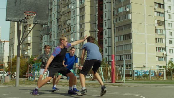 Teenage Streetball Players in Action Outdoors
