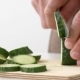 Cook's Hands Cut a Fresh Cucumber on a Board in - VideoHive Item for Sale