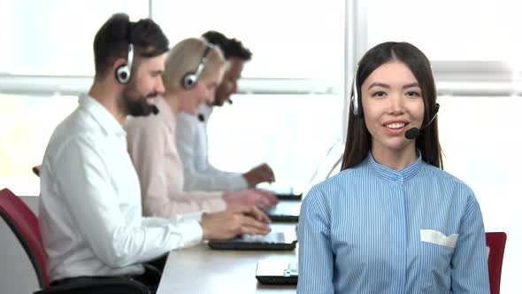 Asian Girl Talking with Headset.