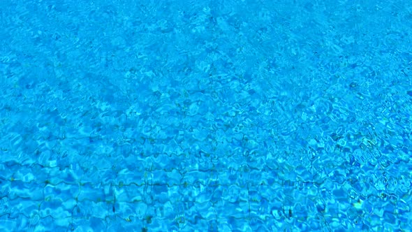 Pure blue water in the swimming pool.