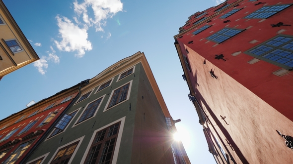 Multicolored Old Houses in Stockholm. Beautiful European Architecture, the Sun Shines From Behind