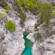 Flight Over a Mountain River and a Trail to a Gorge Among a Coniferous Forest - VideoHive Item for Sale