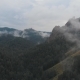 Aerial View of Fog Among the Mountain Peaks. Bad Weather and Fog in the Siberian Nature Reserve - VideoHive Item for Sale