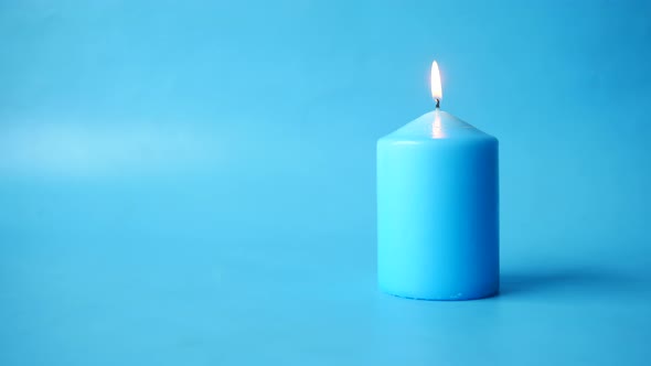 Blue Color Candles Slowly Burning Down