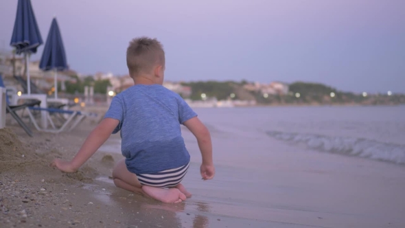 Child Playing at the Beach. Summer Vacation