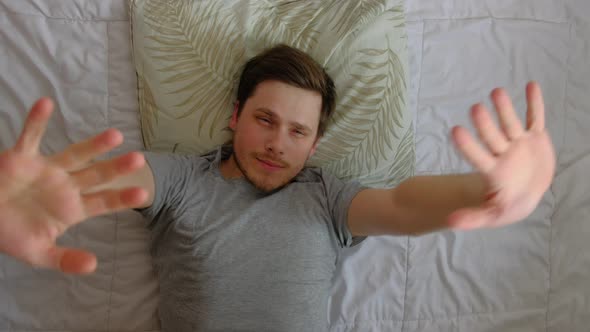 Man Open Eyes in Bed After Sleep