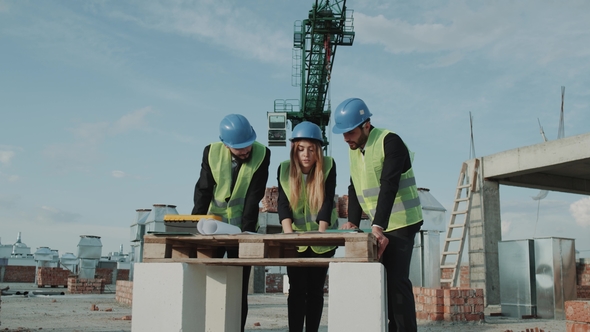 Two Businessmen s in a Suit and One Female Architect Analyzing the Project of a New Apartament alt