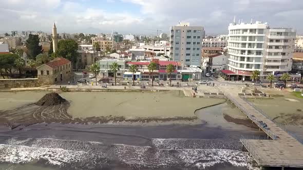 Planned Slider shot From Finikoudes Street Passing By Famous Larnaca Medieval Fort Towards Mackenzie