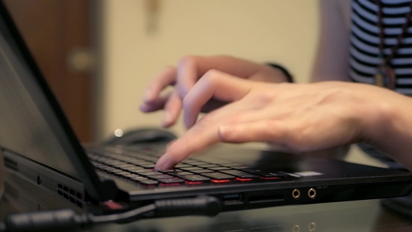 Girl Typing on Laptop