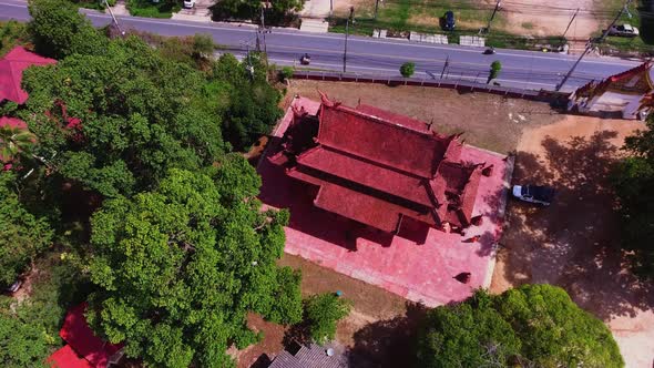 Aerial view of red Buddhist temple in Thailand