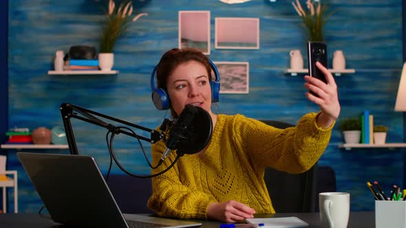 Entertainment Podcaster Taking Selfie During Broadcast