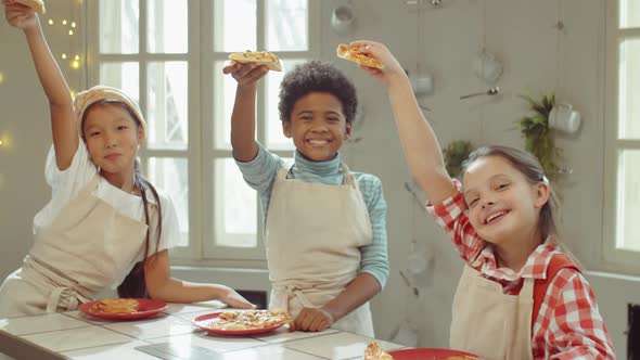 Portrait of Happy Multiethnic Kids with Pizza on Cooking Class