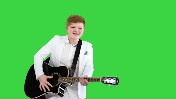 Boy Moves Like Elvis with Guitar on a Green Screen Chroma Key