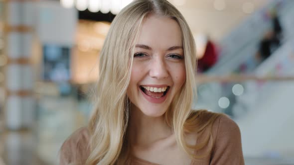 Closeup Portrait of Young Smiling Girl in Mall Happy Satisfied Woman Showing Thumb Up Looking at