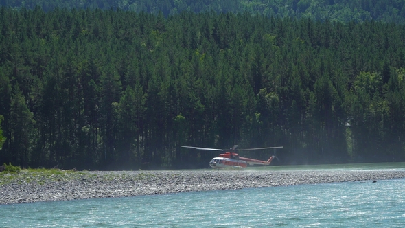 The Mi-8 Helicopter Is on the Bank of a Mountain River