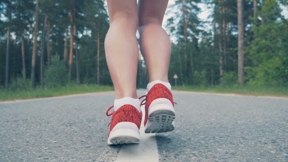 of Female Ankles Starting Running in . Female Athlete Jogging