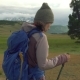 Woman Hiking. Hike in the Mountains. Woman Traveler with Backpack on Beautiful Summer Landscape - VideoHive Item for Sale