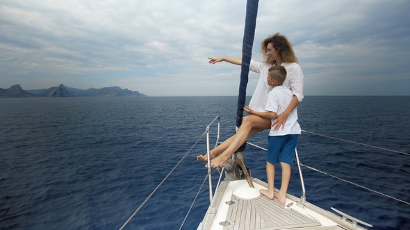 Outdoor Summer Vacation Sailing on Luxury Yacht. Mother