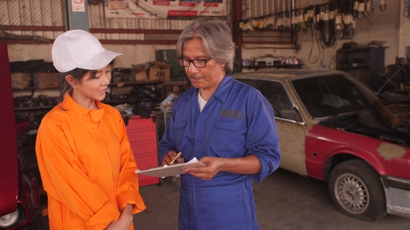 Portrait of Team Professional Mechanic in a Car Workshop.