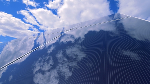 Flat Glasslike Surface of a Solar Platform Is Reflecting Blue Sky