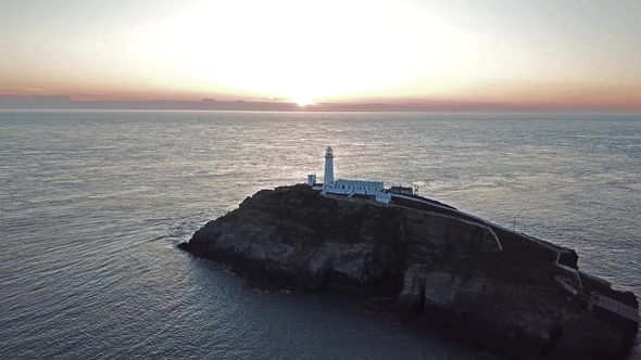 Aerial View of South Stack with Lighthouse and Cliffs During Sunset