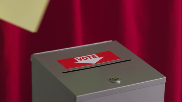 Putting ballot into voting box, election concept