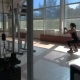 Sportive Young Woman Doing Sit-ups in the Fitness Room - VideoHive Item for Sale