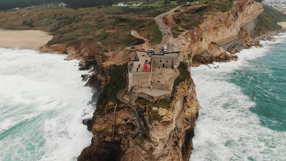 Viewing Point with Lighthouse on Cliff Near Ocean Aerial