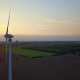 Aerial Footage of a Wind Turbine in Front of the Setting Sun Wind Power - Circling Around Wind - VideoHive Item for Sale