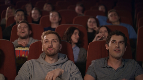 Young People Watching Movie in Cinema Theater. Cinema People Emotion