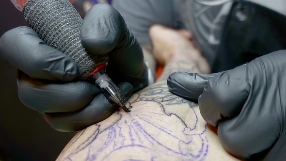 Shot of a Professional Tattoo on the Hand of a Client.