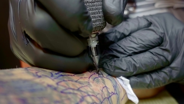 Shot of a Tattoo Artist Doing a Cover Up of an Old Tattoo.