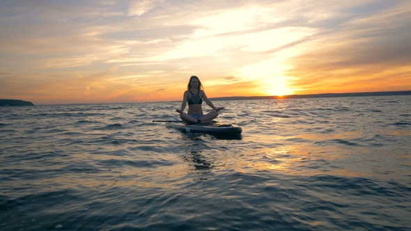 Surfboard Meditation on Water