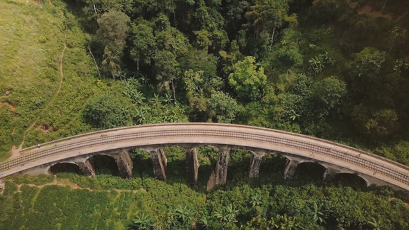 Aerial View, Drone Descending Over Tourists Walking on Nine Arch Bridge Ella in Sri Lanka, Famous