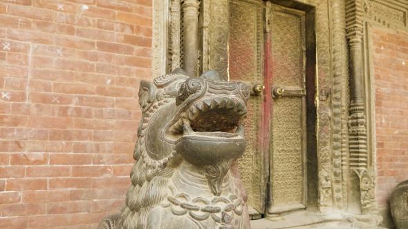 Statue in Ancient City Patan in Kathmandu Valley. Nepal.