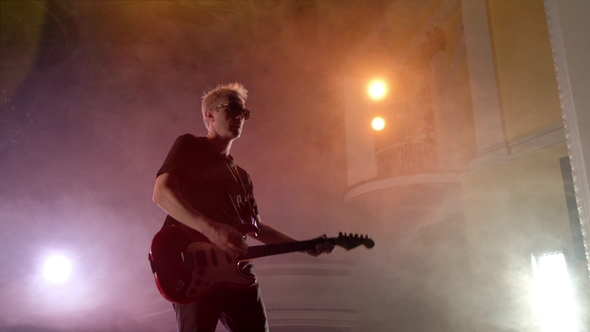 The Guitarist Performs on Stage. Stage Light, Smoke