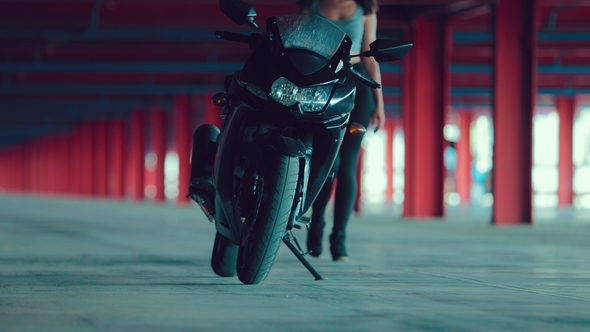 Girl Approaches the Motorcycle, Sits on It, Includes the Ignition and Leaves